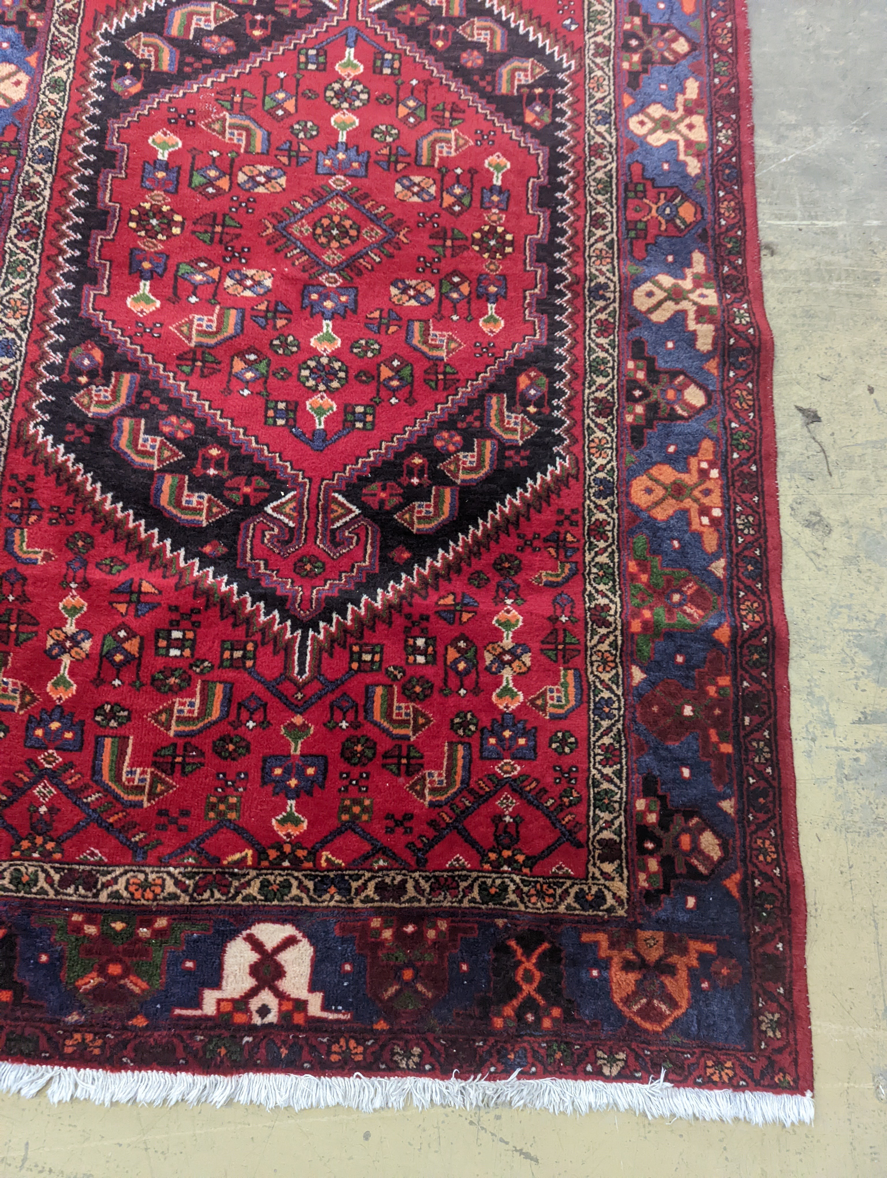 A Hamadan red ground rug, 220 x 130cm